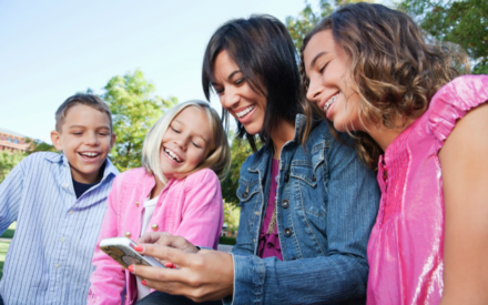 Mother & Children Watching Phone